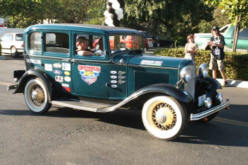 Another Deuce Sedan crosses the Pomona finish line driven by Ron Ferris an 