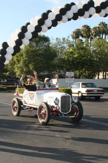 The jubilant team of Howard Sharp and Doug Sharp cross the Pomona finish line in 