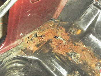 Inside right under back seat.