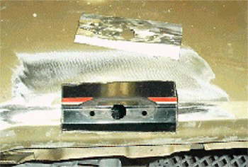 The passenger mirror support inside the door broke free.