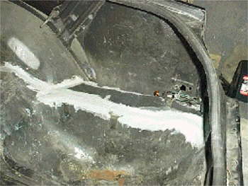 Inside right trunk. New metal & sealed.