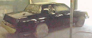 Four coats of black with one coat of clear before car is masked for stripes & lettering 9 Aug 