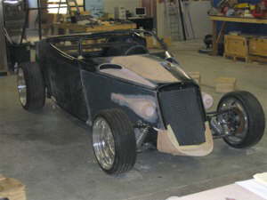 This is what the car is looking like now. The hood and sie panels are getting molds pulled off of them, so it will all be just fiberglass. The bondo was used just to make the shape.