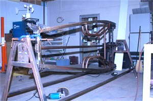 This is what the frame is looking like...almost ready for the powder coaters. The front suspension has been boxed, and all of the lazered out tabs on the chassis have been boxed as well. Compare this one to the was they come from the supplier.