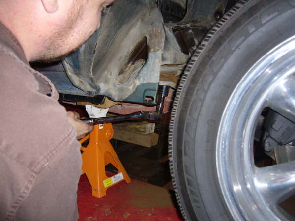 Removing teh 4 bolts that hold the old subframe to the body