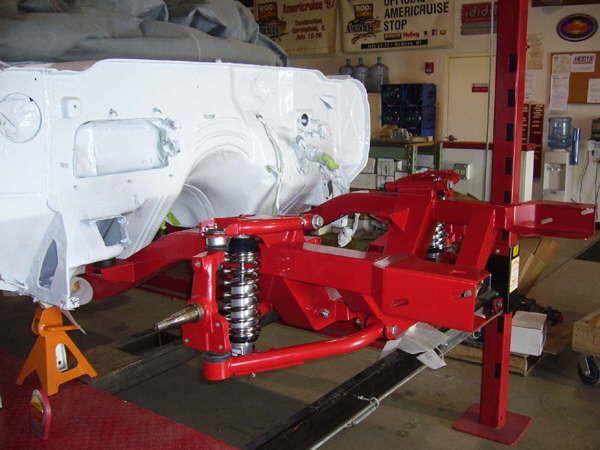 Control arms, spindles, coilover shock installed passenger side.