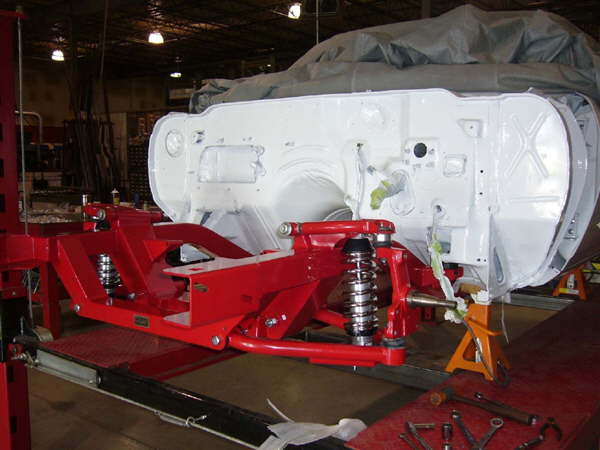 Control arms, spindles, coilover shock installed driver side.