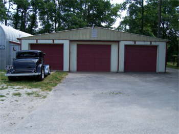 The back of our barn now has three grage doors for our cars and trucks.